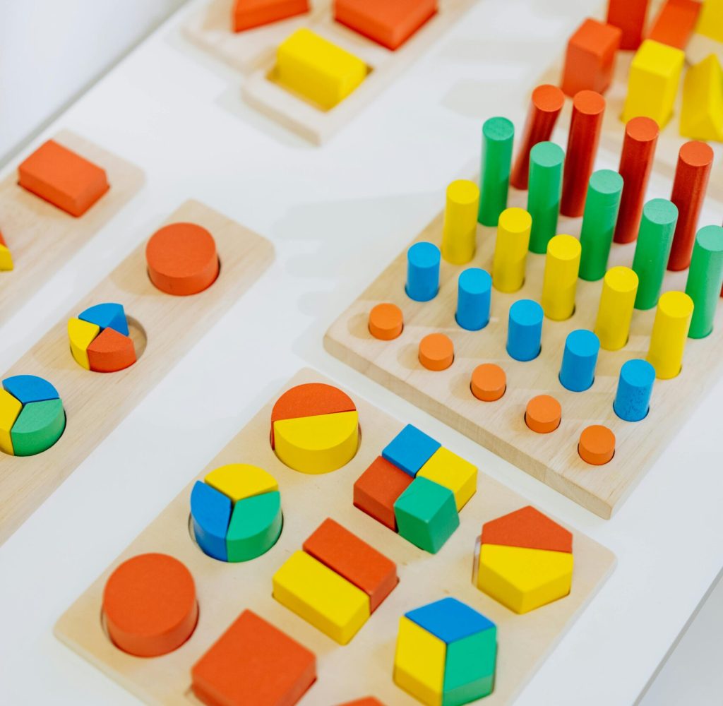 Brightly colored wooden toys for preschool learning and play, enhancing creativity.